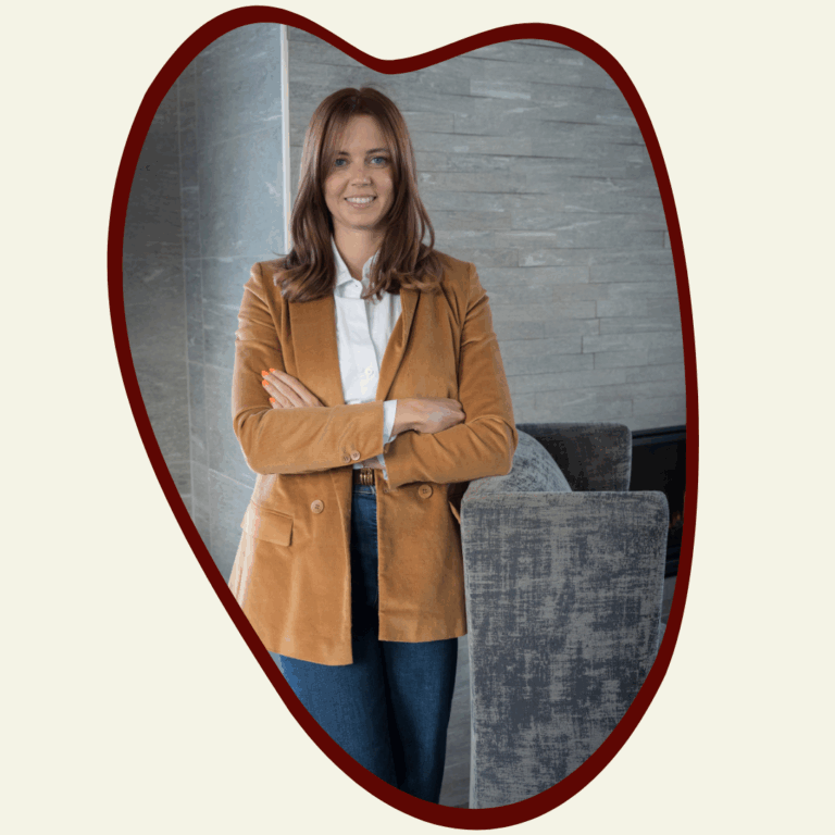 Rebecca Harms leans against a chair
